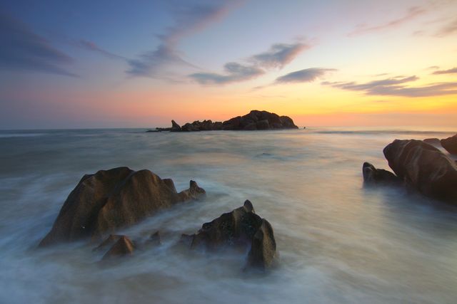 Rock Formation on Body of Water during Golden Hour - Download Free Stock Photos Pikwizard.com