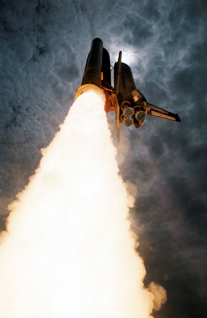 STS050-S-040 (25 June 1992) --- A low-angle perspective captures the Space Shuttle Columbia as it lifts off on its way toward a scheduled record 13-day mission in Earth-orbit. Liftoff occurred at 12:12:23:0534 p.m. (EDT) on June 25, 1992. The modified Columbia is NASA's first Extended Duration Orbiter (EDO). Five NASA astronauts and two scientists/payload specialists are aboard. The seven will divide into two shifts to support United States Microgravity Laboratory 1 (USML-1) research.