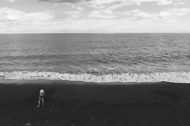 Grayscale Photography of Human Standing on Seashore Near Beach - Download Free Stock Photos Pikwizard.com