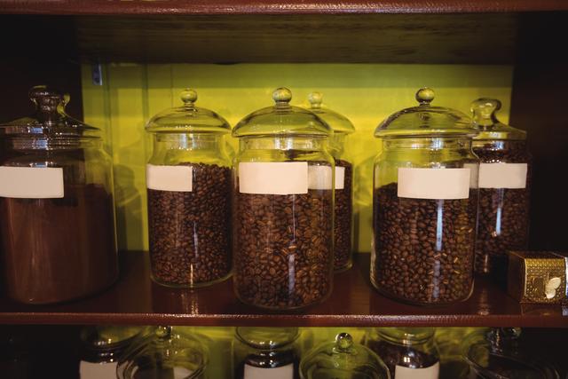 Close-up of jar of coffee beans arranged on shelf - Download Free Stock Photos Pikwizard.com