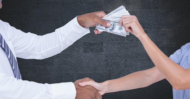 Cropped image of business people's hands holding money representing corruption concept - Download Free Stock Photos Pikwizard.com