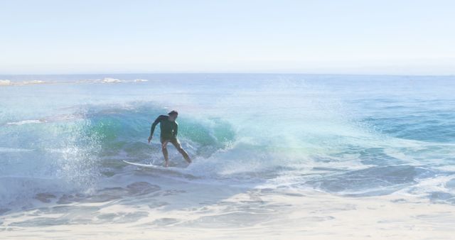 Image of landscape with ocean over caucasian male surfer surfing - Download Free Stock Photos Pikwizard.com