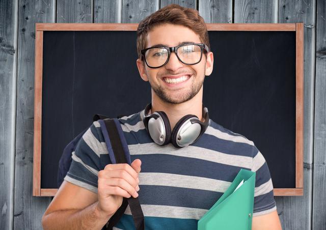 Student with backpack and file standing against blackboard on wooden plank background - Download Free Stock Photos Pikwizard.com