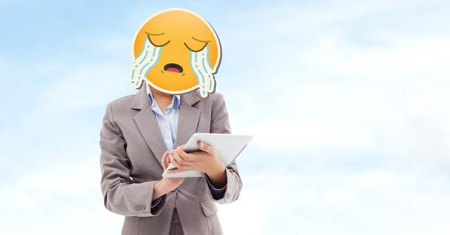 Digital composite image of businesswoman with crying emoji on face using tablet computer - Download Free Stock Photos Pikwizard.com