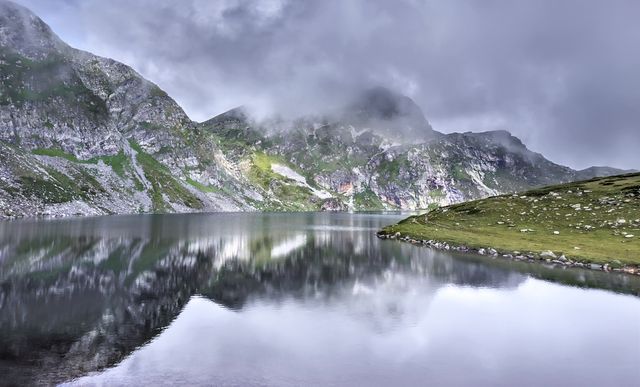 a mountain lake with clouds - Download Free Stock Photos Pikwizard.com