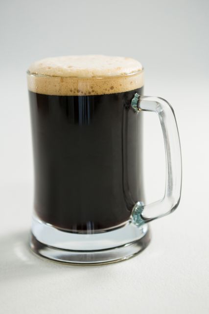 Black beer on white background - Download Free Stock Photos Pikwizard.com