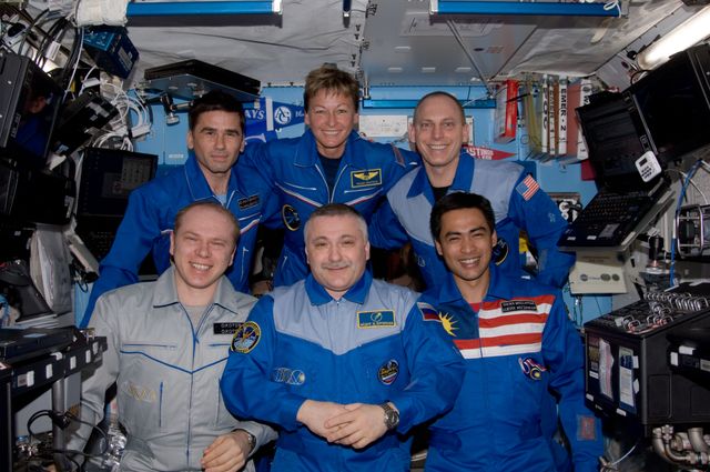 ISS015-E-34617 (16 Oct. 2007) --- The crewmembers onboard the International Space Station pose for a group photo in the Destiny laboratory of the International Space Station. From the left (front row) are cosmonauts Oleg V. Kotov and Fyodor N. Yurchikhin, Expedition 15 flight engineer and commander, respectively, representing Russia's Federal Space Agency; and Malaysian spaceflight participant Sheikh Muszaphar Shukor. From the left (back row) are cosmonaut Yuri I. Malenchenko, Expedition 16 flight engineer representing Russia's Federal Space Agency; NASA astronaut Peggy A. Whitson, Expedition 16 commander; and NASA astronaut Clay Anderson, Expedition 15/16 flight engineer.