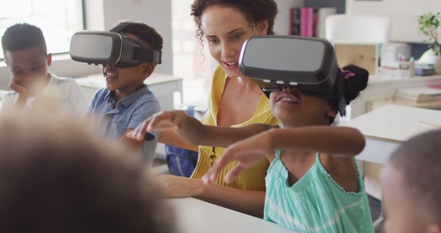 Image of happy caucasian female teacher with class of diverse pupils wearing vr headsets. primary school education and teaching profession.