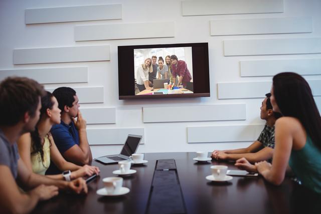 Business executives doing a video conference - Download Free Stock Photos Pikwizard.com