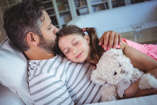 Daughter sleeping in her fathers arms - Download Free Stock Photos Pikwizard.com
