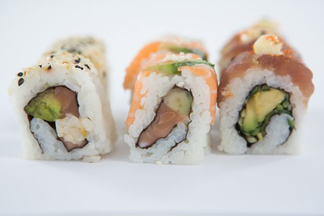 Uramaki sushi roll on white background - Download Free Stock Photos Pikwizard.com