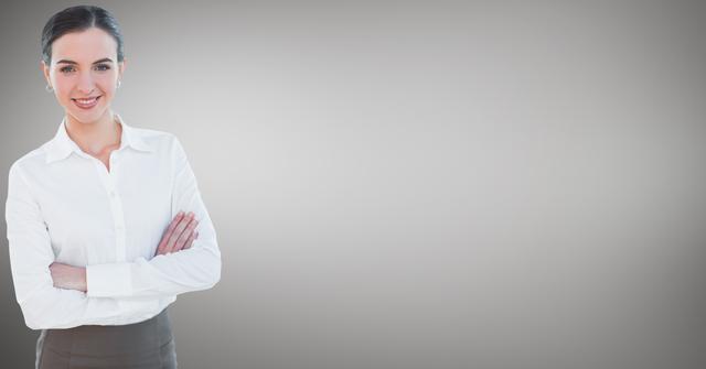 Smiling businesswoman with arms crossed - Download Free Stock Photos Pikwizard.com