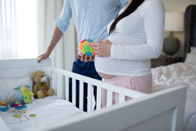 Couple holding toys in bedroom - Download Free Stock Photos Pikwizard.com