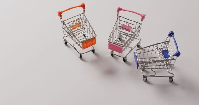 High angle view of three empty shopping trollies on white background with copy space. Shopping, sale and retail concept digitally generated image.
