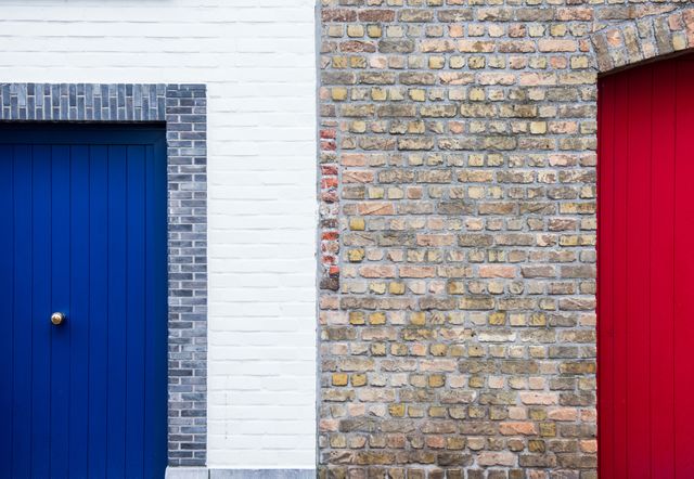 Bricked Wall in Between of Red and Blue Painted Door during Daytime - Download Free Stock Photos Pikwizard.com