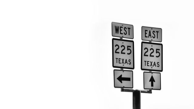 a sign that says west and east - Download Free Stock Photos Pikwizard.com