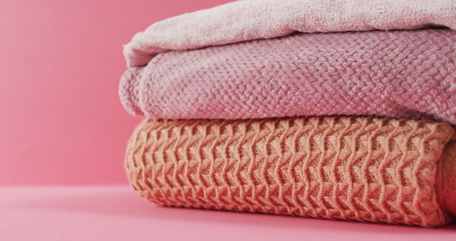 Image of folded blankets lying on pink background - Download Free Stock Photos Pikwizard.com
