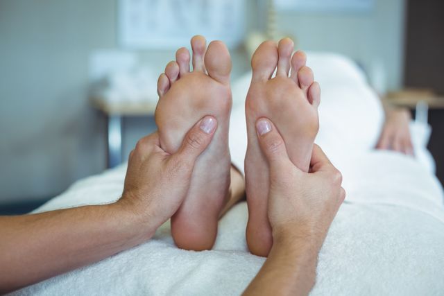 Physiotherapist giving foot massage to a woman - Download Free Stock Photos Pikwizard.com