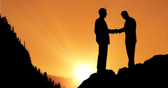 Silhouette businessmen shaking hands during sunset - Download Free Stock Photos Pikwizard.com