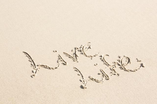 Live life written on sand at beach