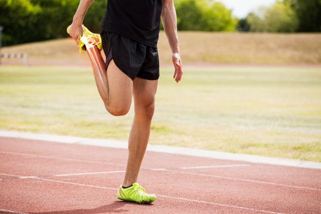 Highlighted bones of athlete man stretching on race track - Download Free Stock Photos Pikwizard.com