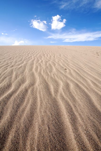 Scenic view of sand dunes against sky - Download Free Stock Photos Pikwizard.com