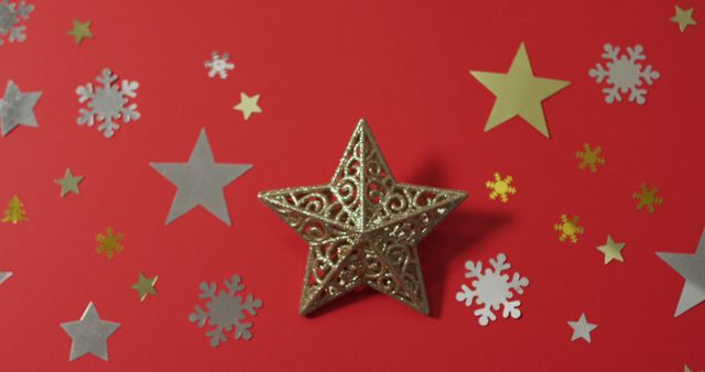 Christmas decorations with stars and snow patterns on red background - Download Free Stock Photos Pikwizard.com