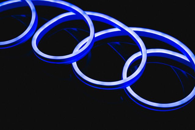 Illustration of illuminated blue neon spiral design against black background - Download Free Stock Photos Pikwizard.com