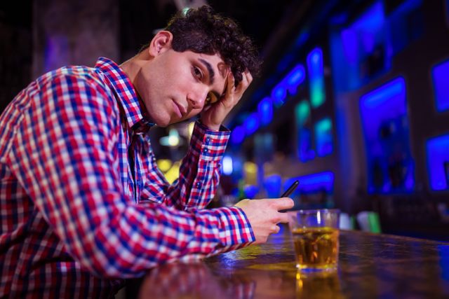 Portrait of sad man at bar counter - Download Free Stock Photos Pikwizard.com