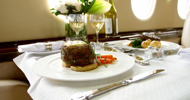 Food and drink served on a table in private jet 4k - Download Free Stock Photos Pikwizard.com