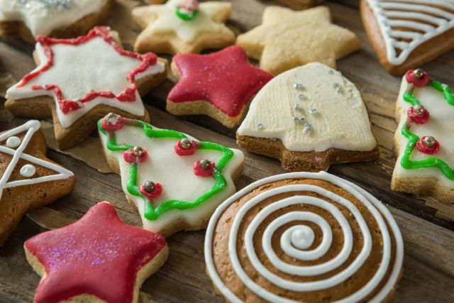 Close-up of gingerbread cookies arranged on wooden plank