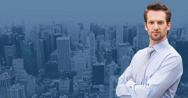 Businessman standing with arms crossed against cityscape - Download Free Stock Photos Pikwizard.com