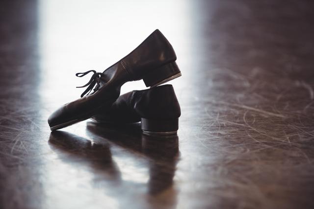 Dancing shoes on wooden floor - Download Free Stock Photos Pikwizard.com
