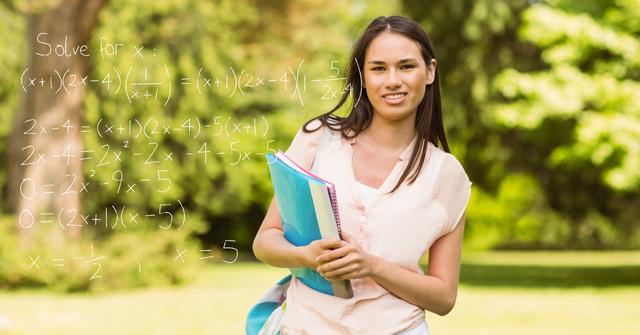 Smiling student with math equation at campus - Download Free Stock Photos Pikwizard.com