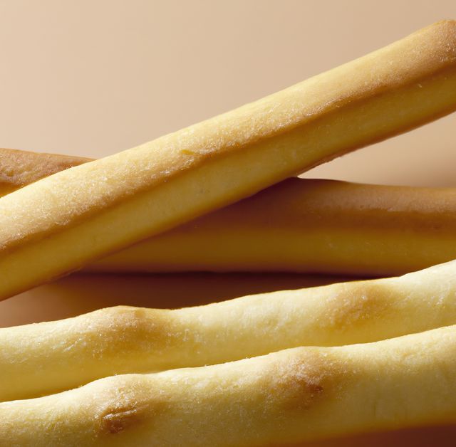 Close up of breadsticks on beige background created using generative ai technology. Food and nutrition concept, digitally generated image.