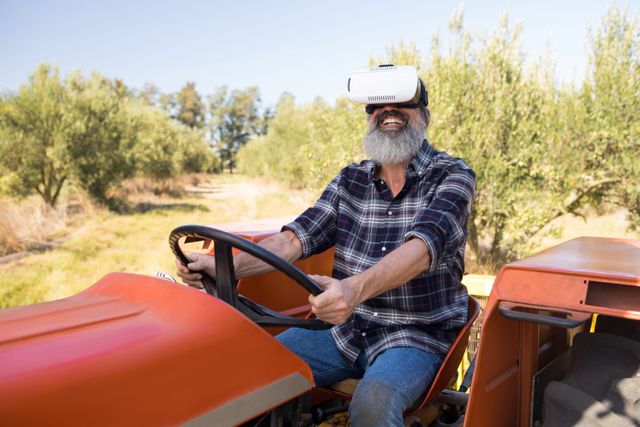 Happy man using virtual reality headset in tractor - Download Free Stock Photos Pikwizard.com
