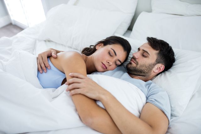 Young romantic couple sleeping on bed - Download Free Stock Photos Pikwizard.com