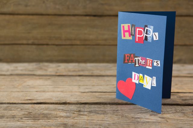 Close up of happy fathers day greeting card on table - Download Free Stock Photos Pikwizard.com