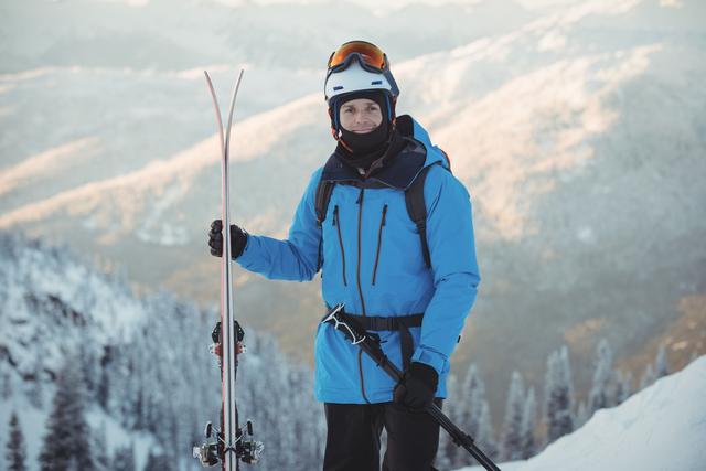 Portrait of skier standing with ski - Download Free Stock Photos Pikwizard.com
