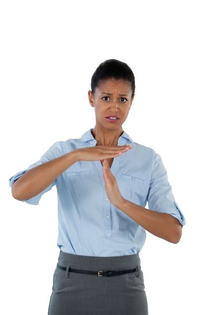 Irritated businesswoman making a timeout hand gesture - Download Free Stock Photos Pikwizard.com