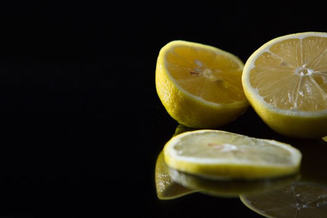 Close-up of fresh lemon on black background