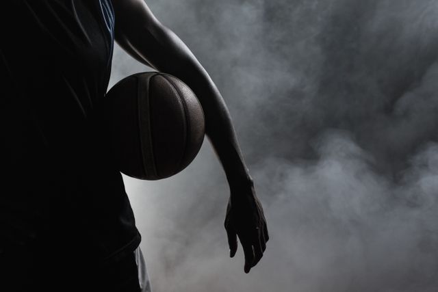 Closeup of a man holding a basketball - Download Free Stock Photos Pikwizard.com