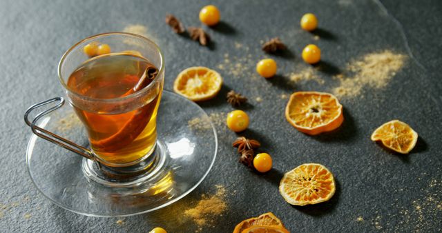 A cozy, aromatic tea setup with cinnamon and orange slices invites relaxation on a cold day. - Download Free Stock Photos Pikwizard.com