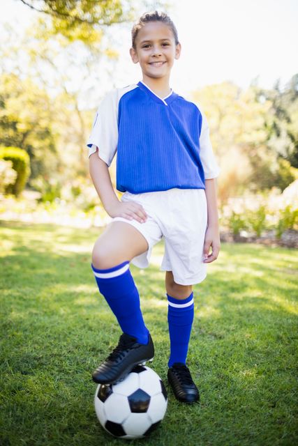 Front view of girl wearing soccer uniform standing - Download Free Stock Photos Pikwizard.com