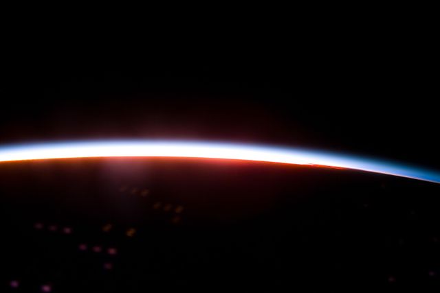 The Earth limb glows shortly after an orbital sunrise - Download Free Stock Photos Pikwizard.com