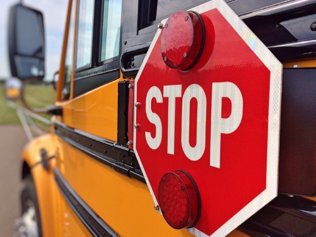 a stop sign on a school bus - Download Free Stock Photos Pikwizard.com