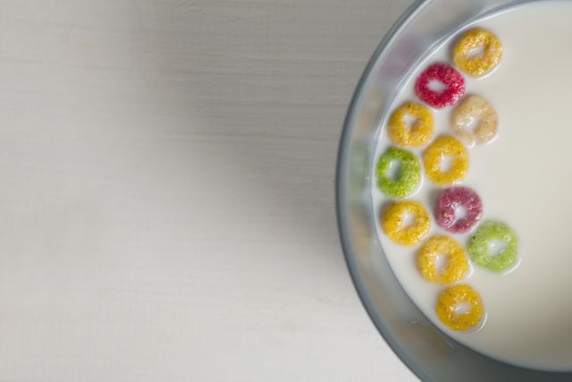 Bowl of milk and cereal rings on white background - Download Free Stock Photos Pikwizard.com