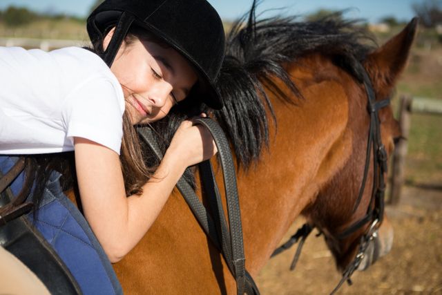 Cute girl embracing horse in the ranch - Download Free Stock Photos Pikwizard.com
