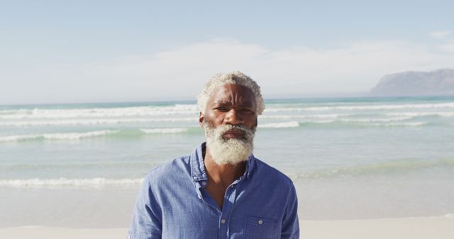 Portrait of senior african american man on sunny beach - Download Free Stock Photos Pikwizard.com