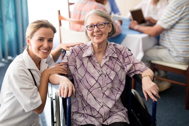 Portrait of smiling female doctor with disabled senior woman sitting on wheelchair - Download Free Stock Photos Pikwizard.com
